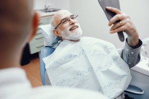 Man admiring self at dentist office